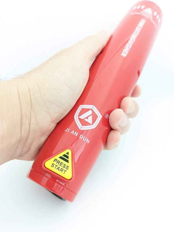 S100 Activation Step 1: Hold Extinguisher In Hand